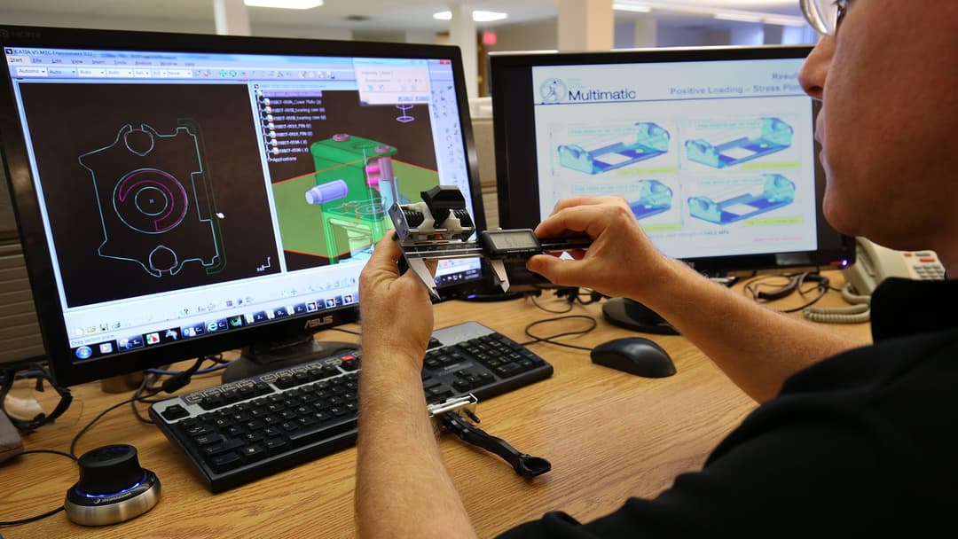 Engineer working on high-volume production components