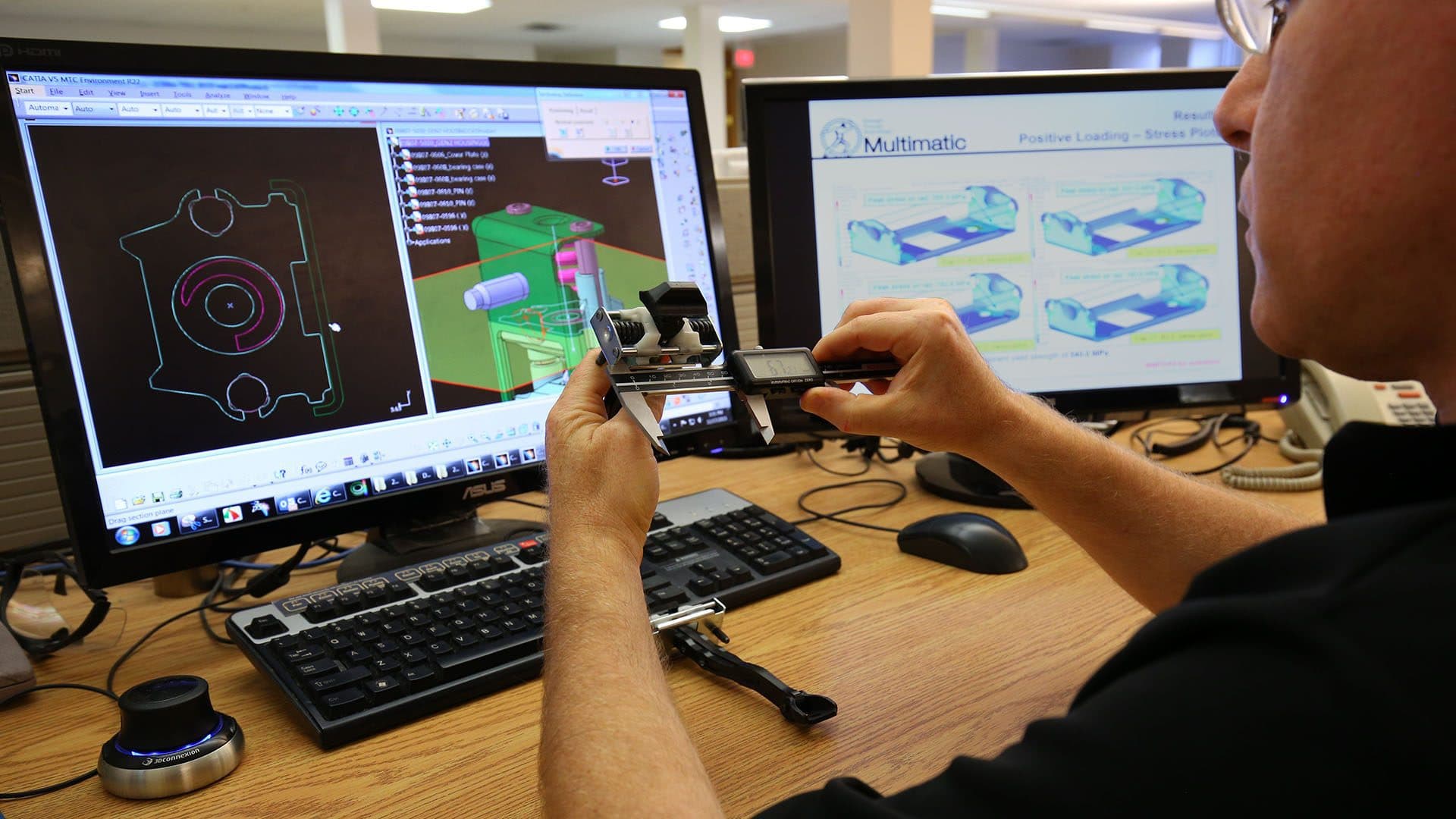 Engineer working on high-volume production components